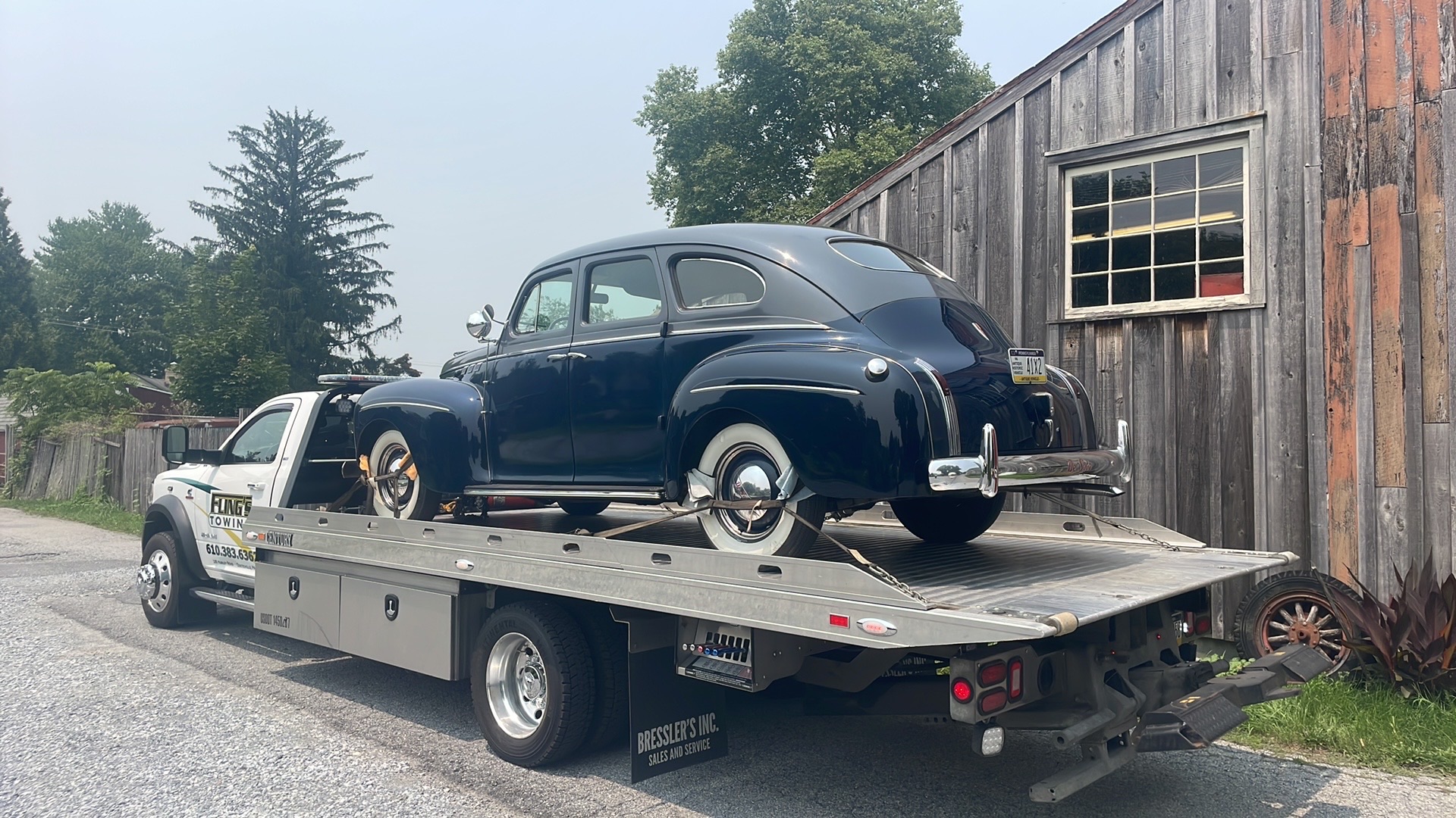 Classic car being towed on a flatbed in Coatesville PA