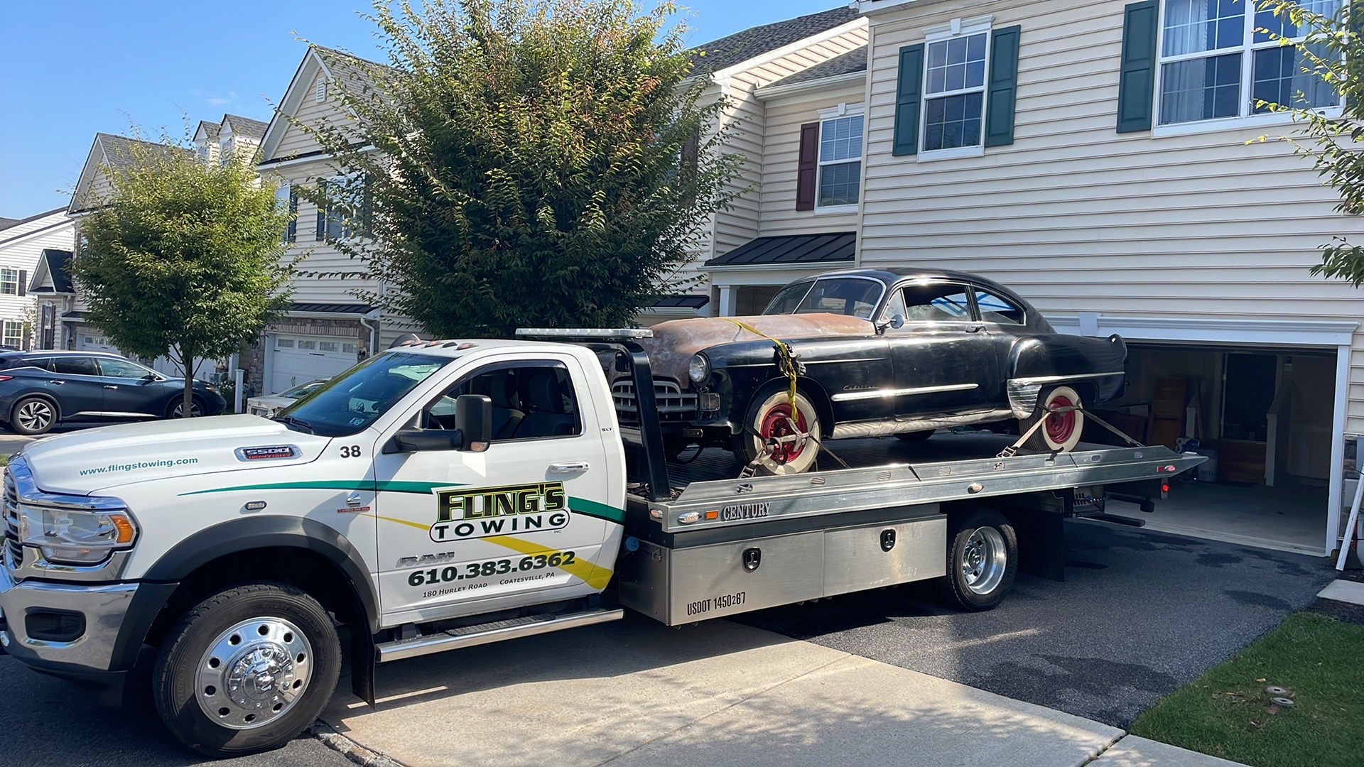 Classic car being towed on a flatbed in Thorndale PA