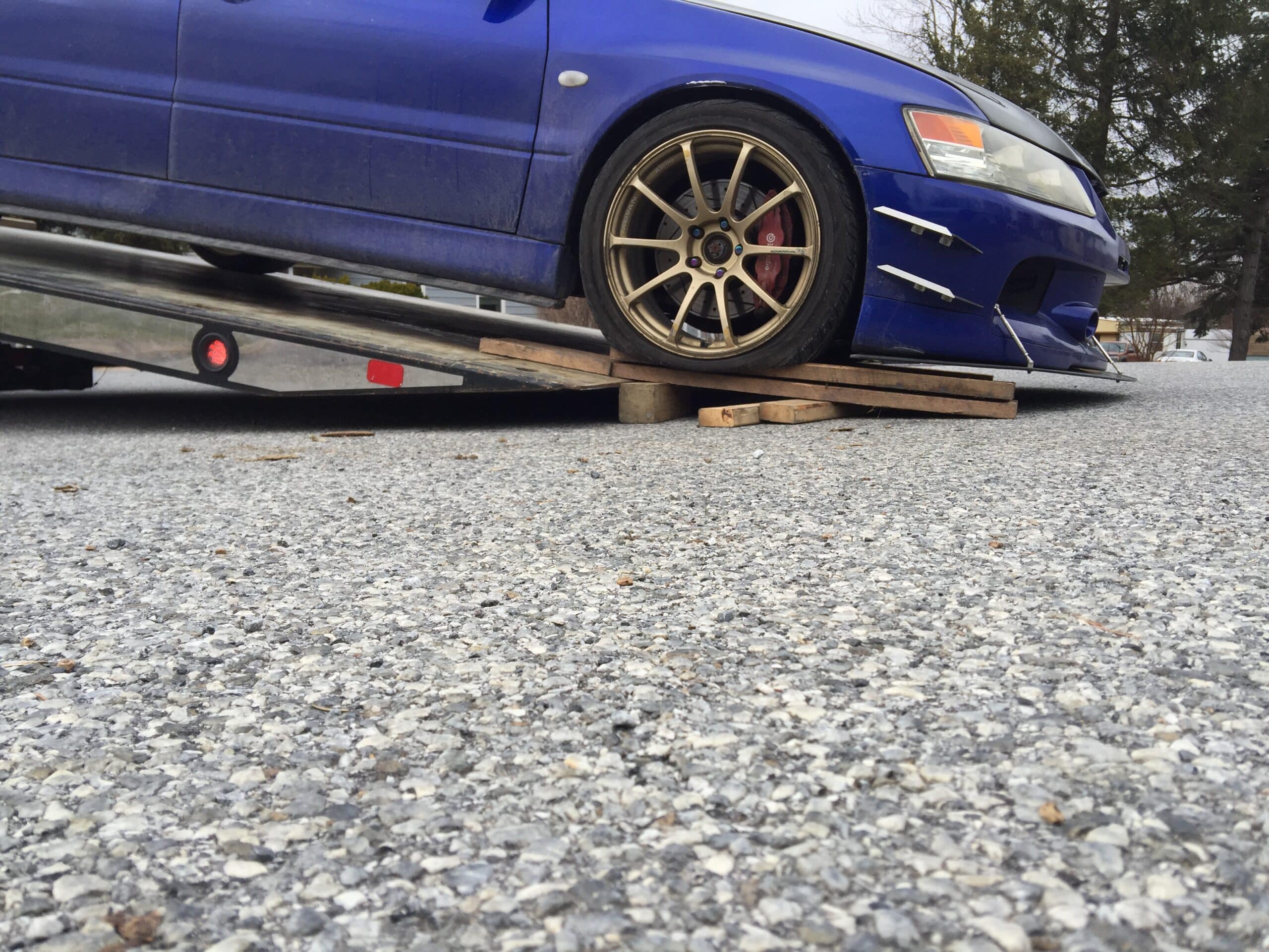 Lowered car being loaded onto a flatbed truck in Coatesville PA