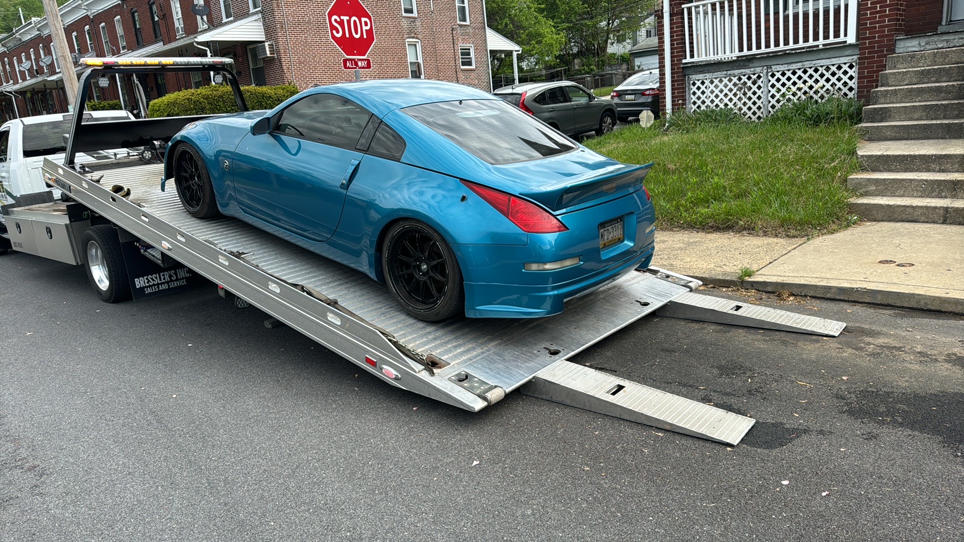Lowered Nissan being towed on a flatbed in Exton PA