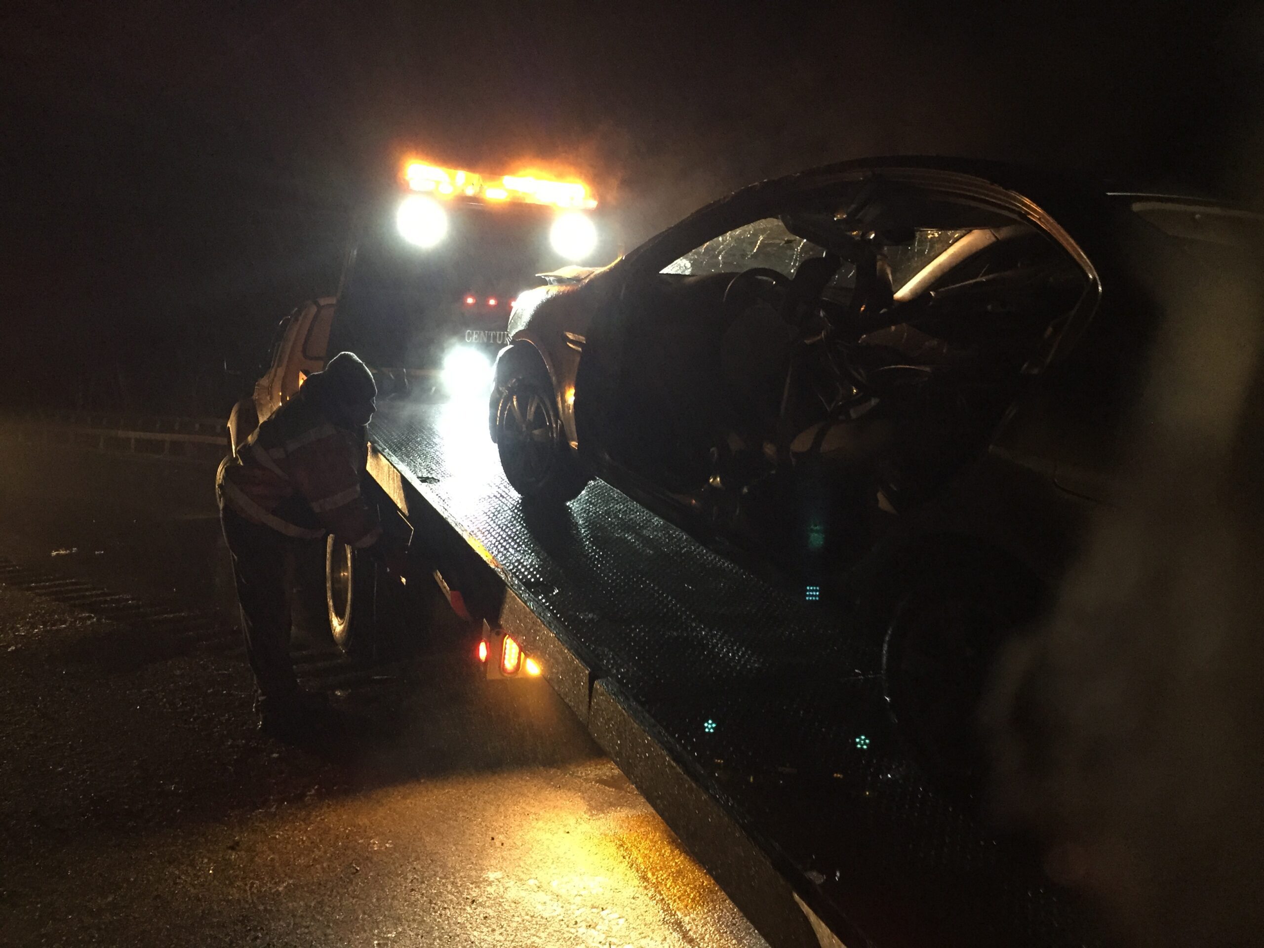 Car being loaded onto a flatbed truck after an accident in Exton PA