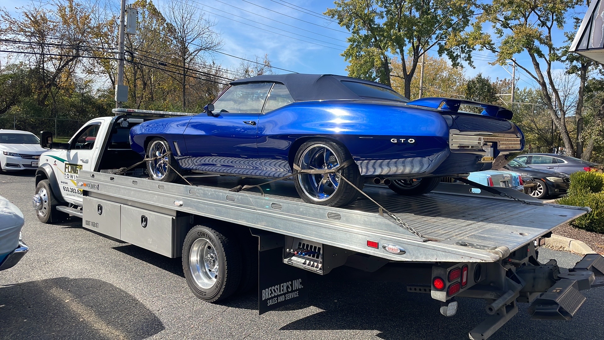 Classic GTO muscle car towed on a flatbed truck in Coatesville PA