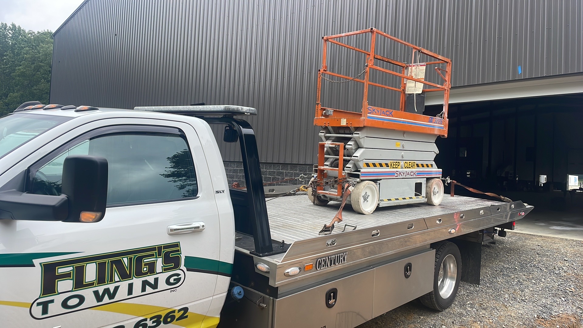 Light duty truck towing a specialty equipment lift in Chester County PA