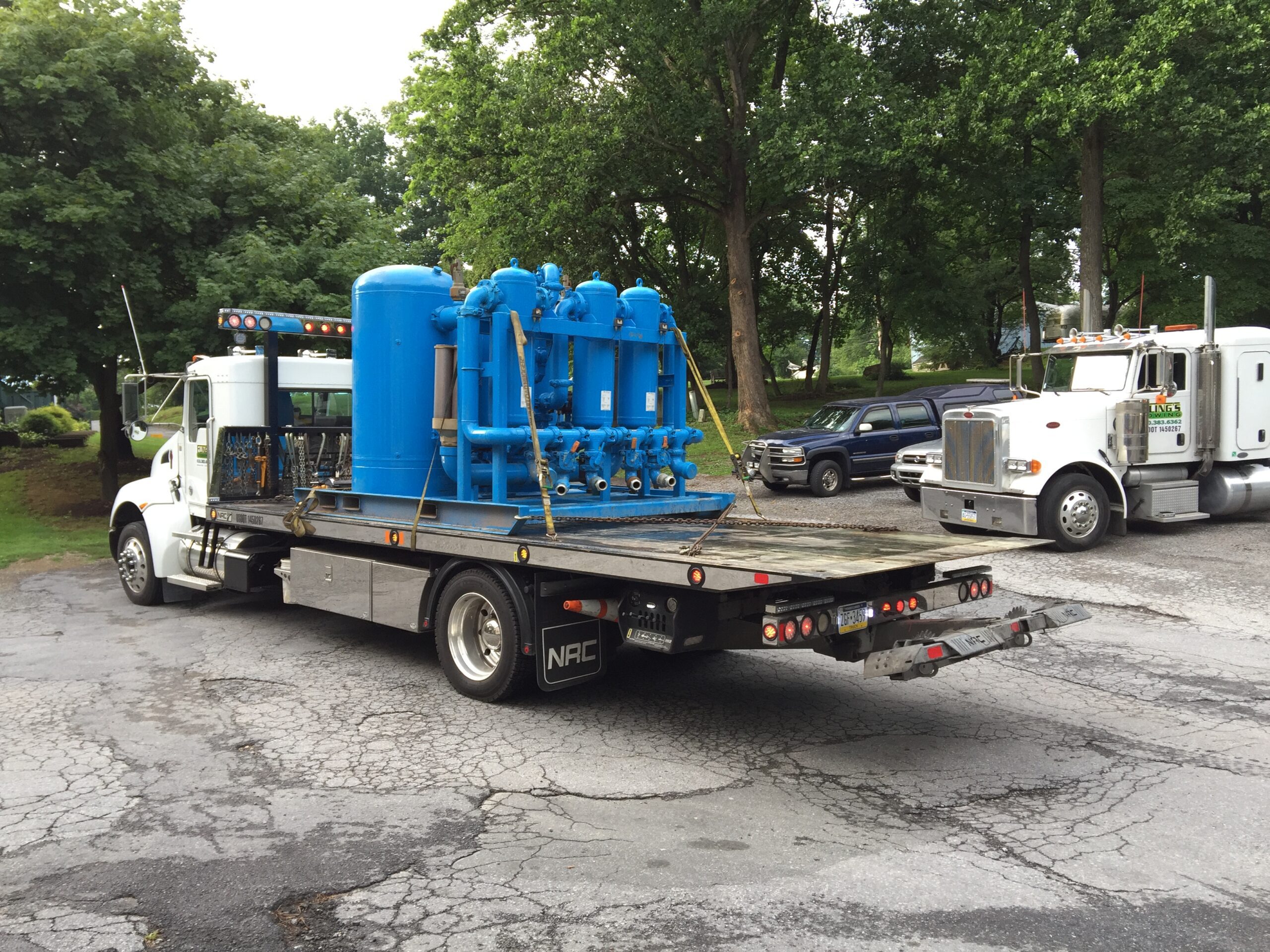 Equipment being moved on a heavy duty flatbed truck in Parkesburg PA