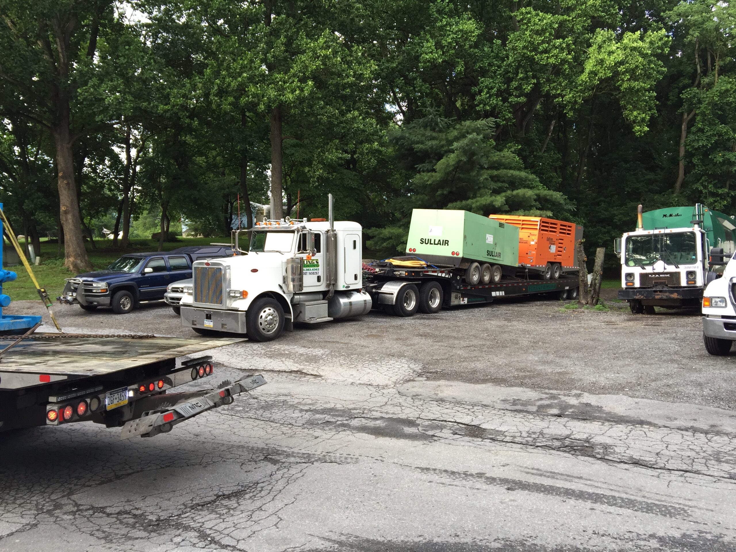 Equipment being moved on a heavy duty flatbed truck in Parkesburg PA