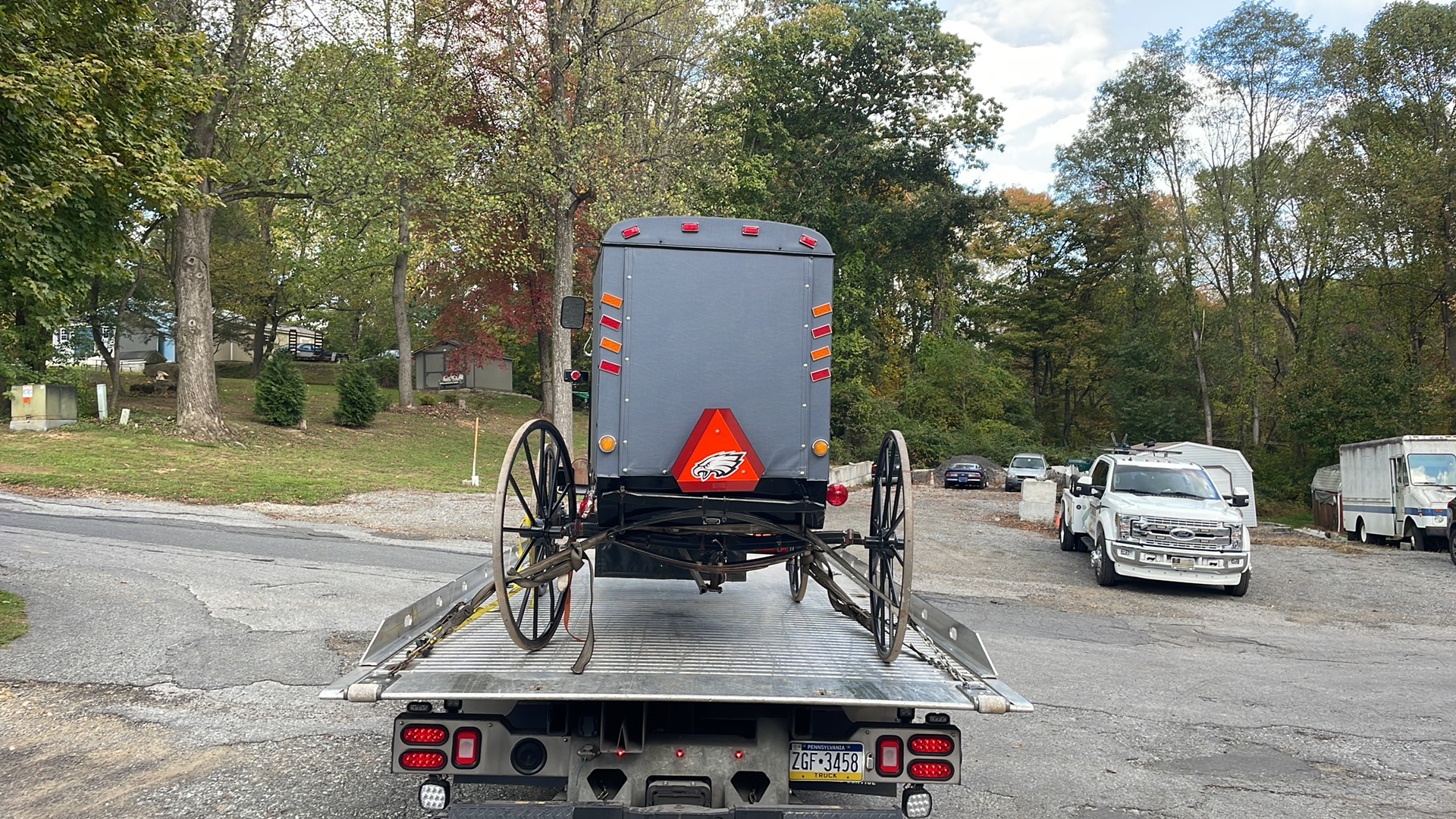 Antique horse and buggy being towed on a flatbed truck in Thorndale PA